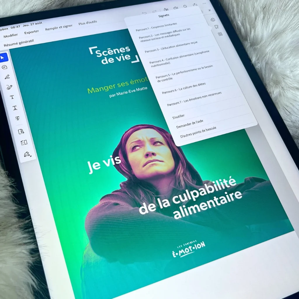 Tablette affichant la couverture du guide « Je vis de la culpabilité alimentaire », de la série Scènes de vie : Manger ses émotions, par Marie-Eve Matte, aux Éditions Émotion.